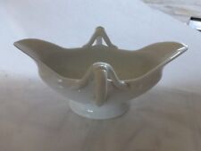 ancienne saucière Louis Philippe en porcelaine blanche sur piedouche 12 €