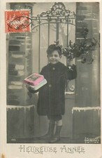 CP HAPPY YEAR LITTLE BOY WITH GIFTS MISTLETOE IN FRONT OF PORTAL