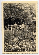 Portrait couple man woman garden table - 2 old photo year. 1940