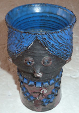 Africanist vase depicting an African woman holding a flower signed Thérèse Bataille