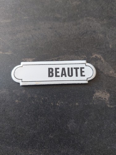 Plaque émaillée beauté