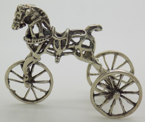 Figurine cheval bascule - à,
