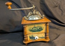 Antique wooden and metal coffee grinder, celluloid decor countryside Holland mill