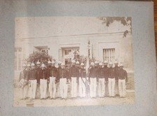 3 photos on cardboard firefighters with helmets 1855 and arm pumps 