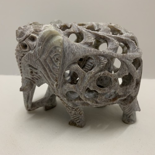 Gray carved stone elephant - gray,