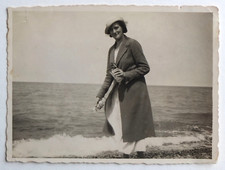 Elegant woman empty lava glass sea - old photo snapshot
