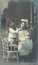 CP LITTLE BOY HOLDING CHIN LITTLE GIRL UMBRELLA - 58821