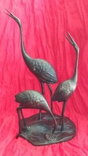 Beau bronze avec 3 héron
