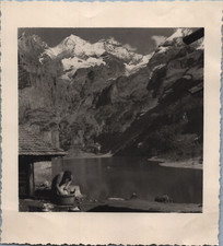 Switzerland, Lake d&#039;Oeschinen, woman washing laundry, vintage print, ca.1930 Sui