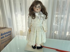 Poupée tête porcelaine 62