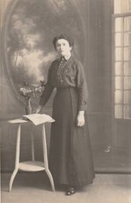 Old postcard photo card young woman in the Sellette