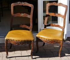 Pair of large Louis XV era walnut chairs and leather seats, 18th century