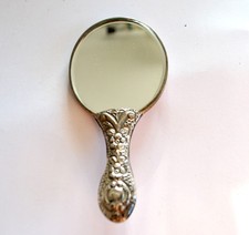 Miroir de poche ancien face à