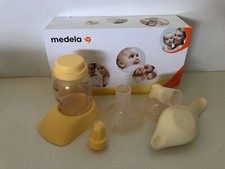 Tire-lait manuel Medela Harmony, avec aspirateur Calma et inserts d'allaitement