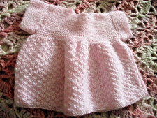 pink dress knitted hand doll