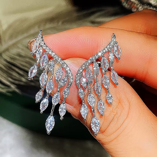 Boucles oreilles ailes - ✨,