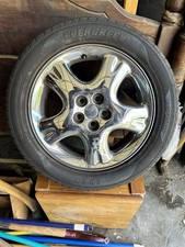 Four Chrome PT Cruiser Rims W/Tires On. 