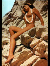 NATURISM / Miss Judy with TANNING SHELL NECKLACE on ROCKS