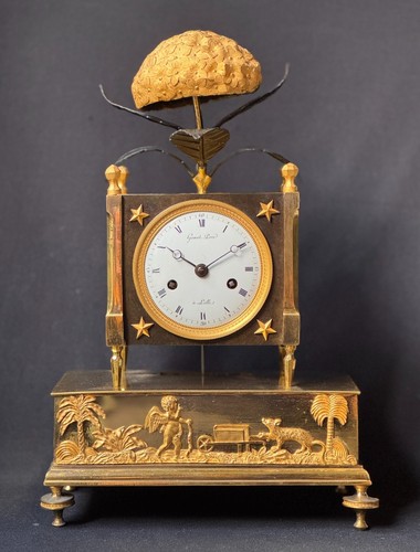 Pendule bronze doré dite - en,