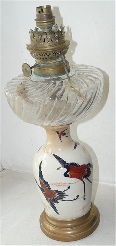 Lampe petrole faience et - a, en