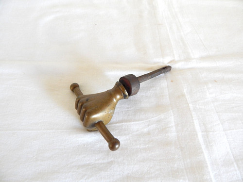 Old bronze door handle hand - old,