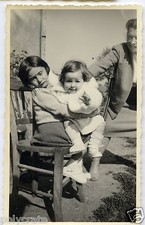 Portrait Children Sitting on a Chair - Old Year Photo. 1950