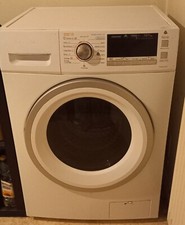 LAVE-LINGE SECHANT BLANC ET