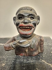 Tirelire mécanique ancienne