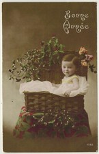 Antique postcard-Baby sitting in a wicker basket-Ed.Artige