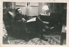 Snapshot Man Sitting In Leather Chair With Newspaper Cigarette Living Room Lamp