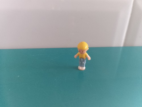 Polly pocket figurine doll