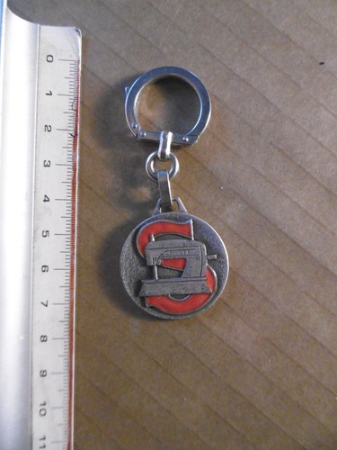 Singer porte cle - .,