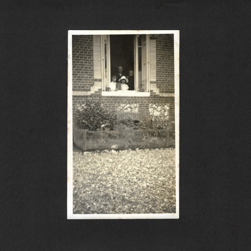Family behind open window