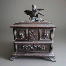Pretty wooden box carved with jewelry black forest style. 