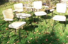 Suite de 4 fauteuils en skaï