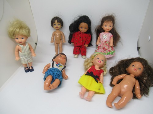 Lot poupées barbie baby - 7,