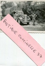 PHOTO OF A MILITARY VEHICLE SOLDIERS NEAR THE BUMP TRUCK