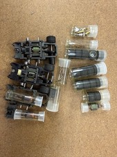 TYCO RACING CHASSIS WITH ROCKET ARMATURES, HEAT SINKS AND MISC. SOLD AS IS