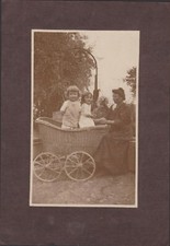 ANTIQUE PHOTOGRAPHY YOUNG CHILDREN IN A WICKER CRADLE ON WHEELS