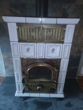 poêle oliger a bois version 2 ,blanc doré très bon état prix peut-être négociabl