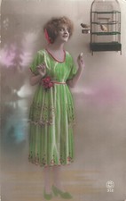 CP WOMAN ELEGANT SMILING NEAR CAGE BIRDS - CUT