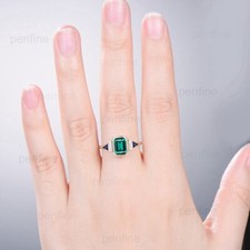 Unique Bezel Set Emerald Cut
