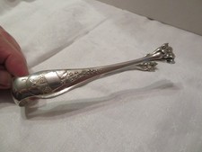 pince à sucre Ercuis à décor de brun de muguet en métal argenté