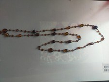Long collier en perles d' ambre deux couleurs polies