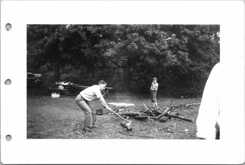 1941 handsome man chopping - handsome,