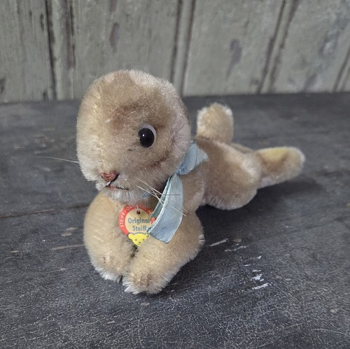 Steiff lapin couché avec - couché,