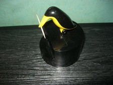 ANTIQUE YELLOW AND BLACK PELICAN DESIGN PLASTIC TOOTHPICK HOLDER
