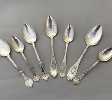 A mixed lit of eight silver plated table spoons in the Medallion pattern, 