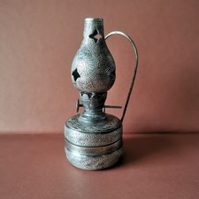 Antique oil lamp burns /