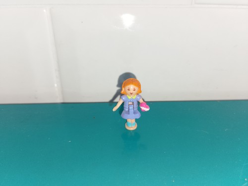Polly pocket figurine doll